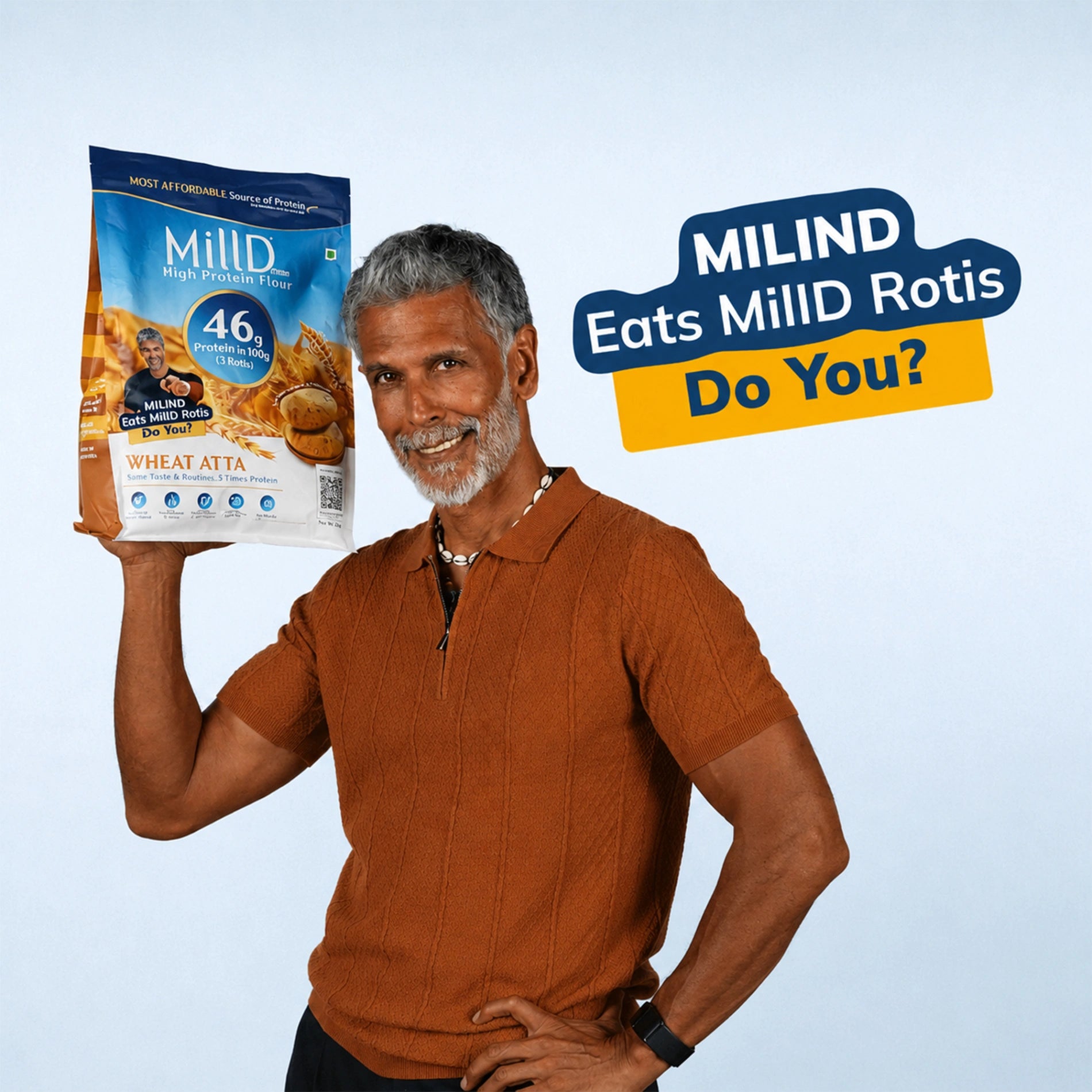 Milind Soman holding MillD High Protein Atta promoting 46g protein wheat flour 