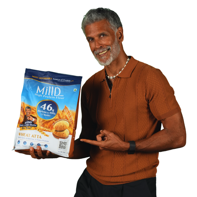 Milind Soman holding MillD High Protein Atta
