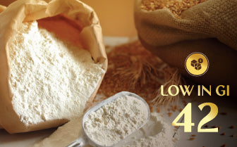Milld low-GI wheat flour roti placed beside wheat grains, showing a glycemic index value of 42 suitable for diabetics and elderly users